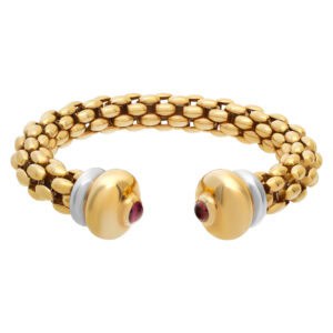 Box link bangle with ruby cabachon end caps in 18k