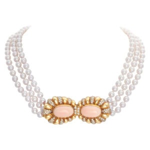 Multi string pearl necklace with 18k Coral diamond decorate clasp