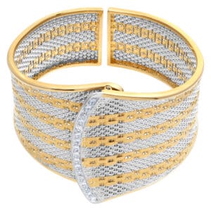 Bold 18k white & yellow gold bangle with diamond bar