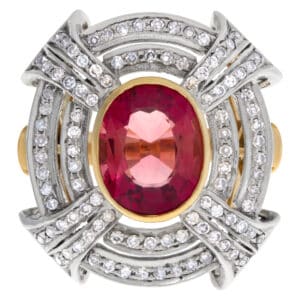 Superb ring with center oval cut tourmaline enhanced with over 1.5 carat diamond accents set  in 18k white & yellow gold