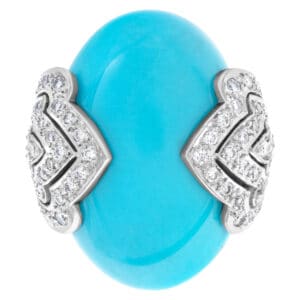 Oval cabochon Persian turquoise ring accented with approx. 1 carat diamonds set in 18K white gold.