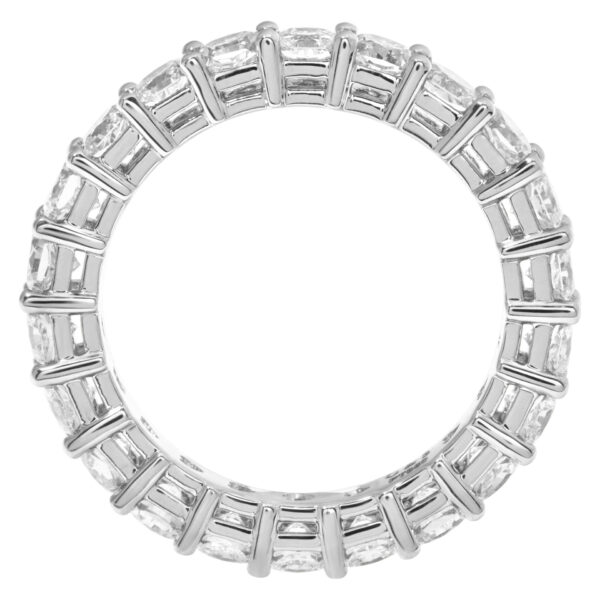 Diamond eternity band with 22 radiant cut diamonds, totaling 3.35 carats set in platinum.