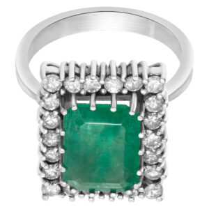 Emerald ring with approximately 4 carat in emerald framed by approximately .66 carats round diamonds in 14k white gold