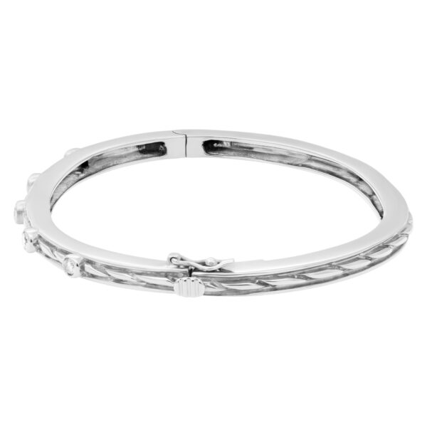 Beautiful bangle with five diamonds total  0.50 carats set in 14k white gold