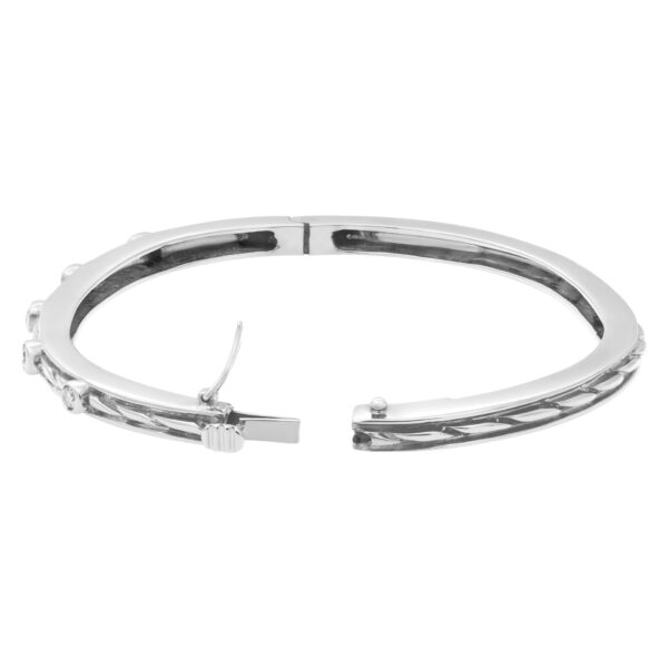 Beautiful bangle with five diamonds total  0.50 carats set in 14k white gold