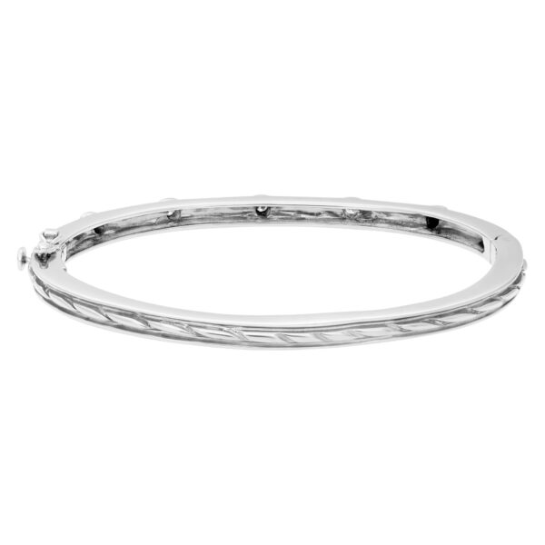 Beautiful bangle with five diamonds total  0.50 carats set in 14k white gold