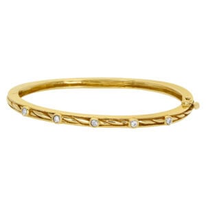 Unique design bangle with five diamonds .35 cts in total weight in 14k yellow gold