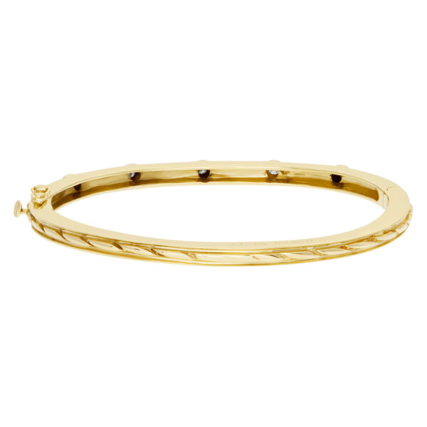 Bangle bracelet with 5 swirls in 14k yellow gold and diamonds