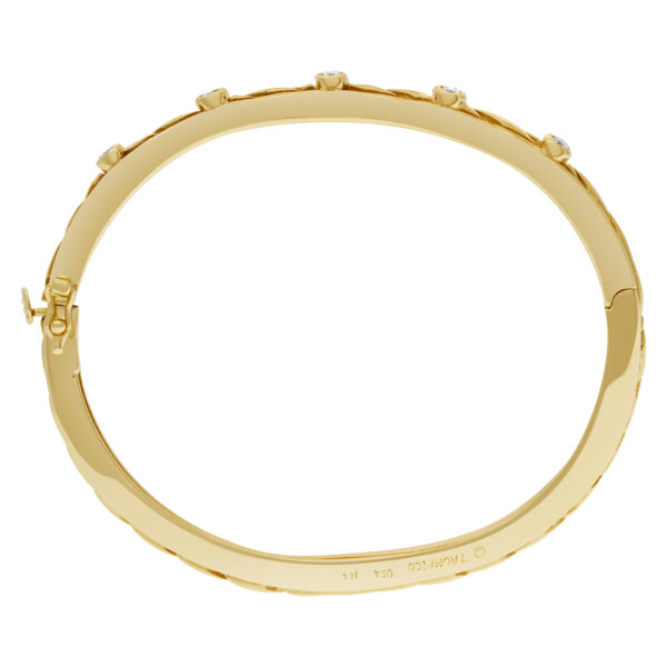 Bangle bracelet with 5 swirls in 14k yellow gold and diamonds