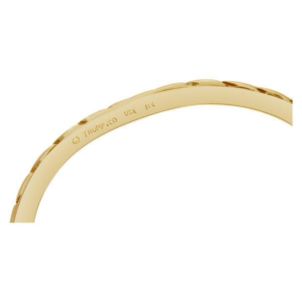 Bangle bracelet with 5 swirls in 14k yellow gold and diamonds