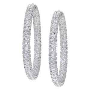 Pave diamond hoop earrings mounted in 14k white gold