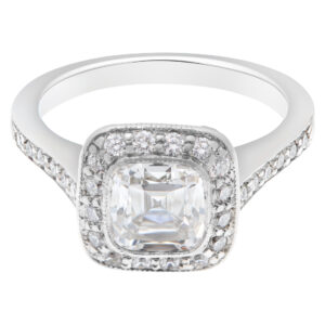 Tiffany & Co. Legacy Diamond Engagement Ring in platinum, 1.20 carat cushion cut F color VS1 clarity center with 0.32 carats in F-G color, VS clarity round diamond accents in halo style setting