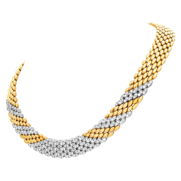 Stylish "PANTHERE" link style necklace with over 8.50 carats full cut round brilliant diamonds  set in 18K yellow gold.