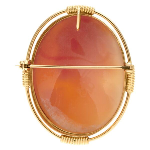 Shell Cameo pin/pendant portrait of a short hair lady set in 14k yellow gold.