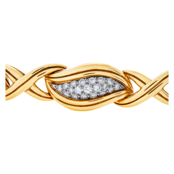 Stylish "Hugs & Kisses" bracelet with over 3.50 carats full cut round brilliant diamonds set in 18K yellow gold.