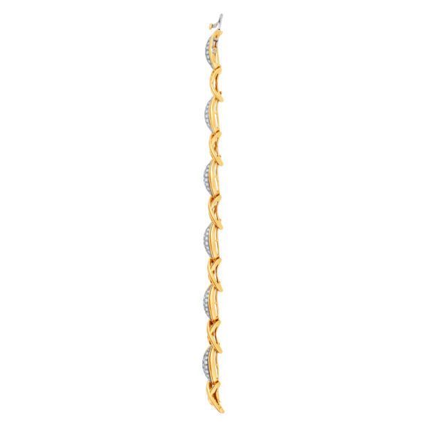 Stylish "Hugs & Kisses" bracelet with over 3.50 carats full cut round brilliant diamonds set in 18K yellow gold.