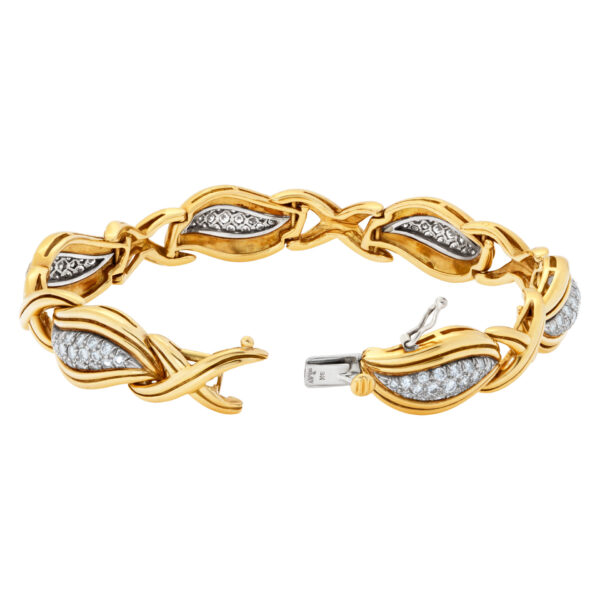 Stylish "Hugs & Kisses" bracelet with over 3.50 carats full cut round brilliant diamonds set in 18K yellow gold.