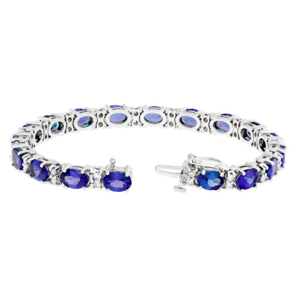 Line bracelet with oval tanzanite and round diamonds in 14k white gold