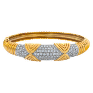 Diamond bangle in 18k yellow and white gold with approx. 4 carats in pave diamonds. Signed JT