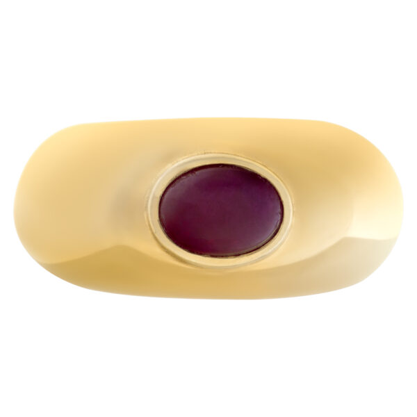 Designer signed "T" cabochon ruby set in 18 Kt yellow "Gipsy" ring style. Size 7.25.