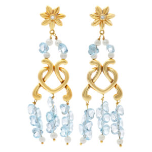 Floral style 18k earrings with blue stones