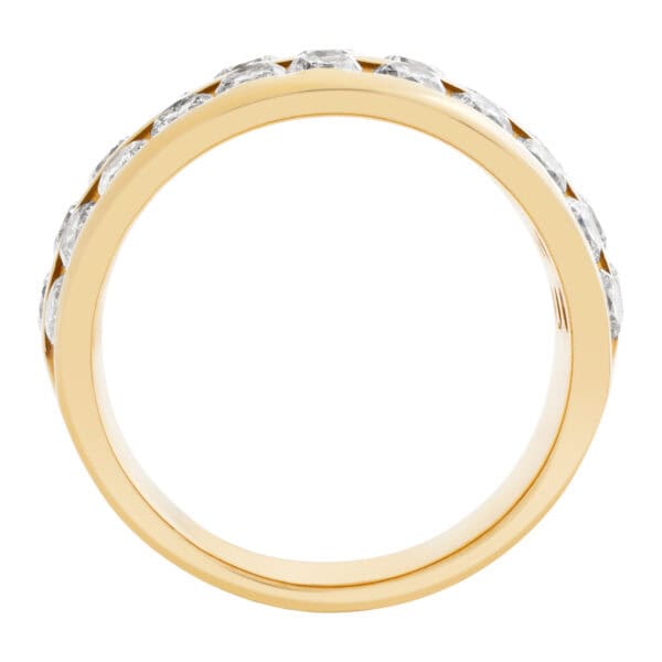 Wide band in 14k yellow gold. 1.50 carats in 3 rows of channel set diamonds