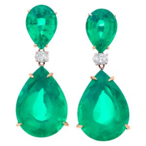 A lot of color for little money. Dangling pair of earrings with four pear shape synthetic lab made emeralds, set in 18k white and yellow gol